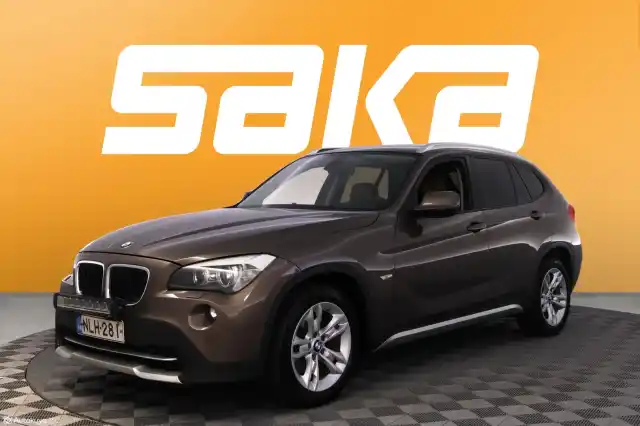 Ruskea Maastoauto, BMW X1 – NLH-281