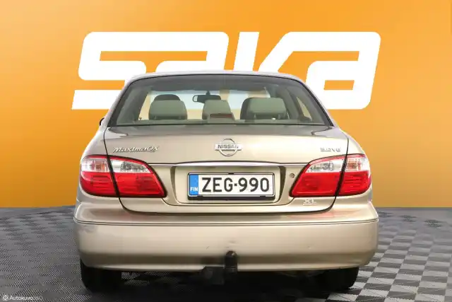 Beige Sedan, Nissan Maxima – ZEG-990