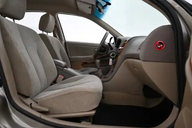 Beige Sedan, Nissan Maxima – ZEG-990