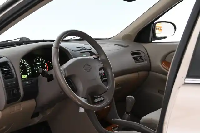 Beige Sedan, Nissan Maxima – ZEG-990