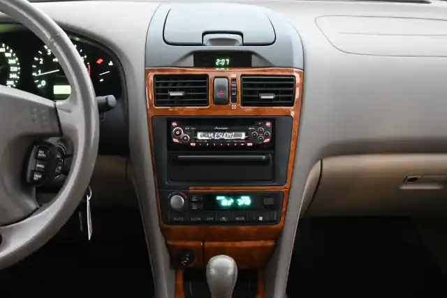 Beige Sedan, Nissan Maxima – ZEG-990